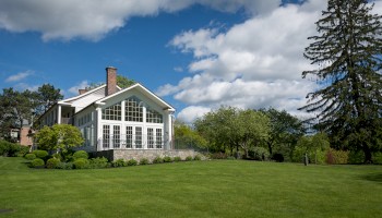 elegant building in a green grass scenery and sunny day