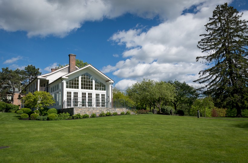 elegant building in a green grass scenery and sunny day